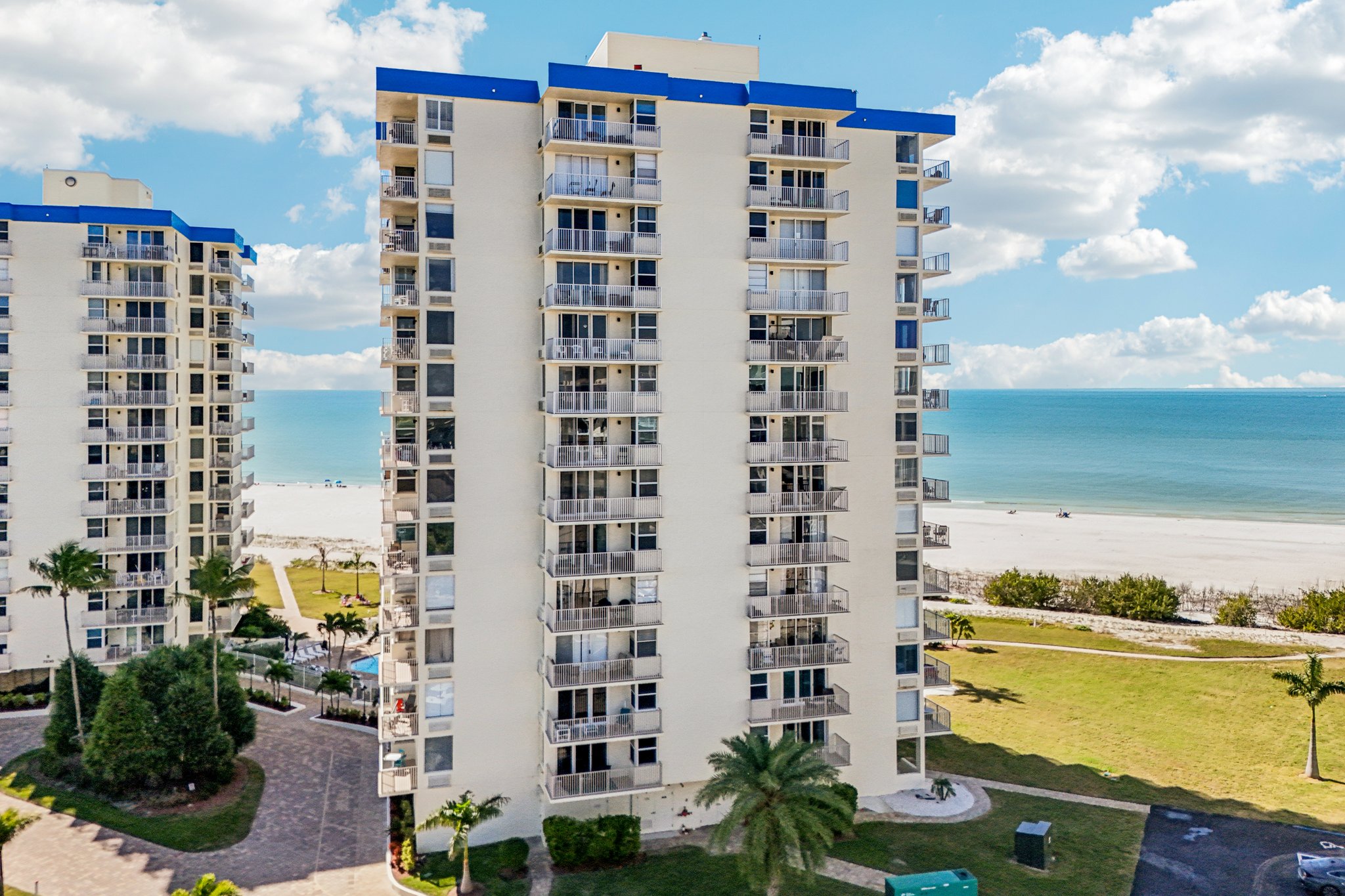 Drone photo of a Gulf-front condo tower on Estero Blvd, Fort Myers Beach