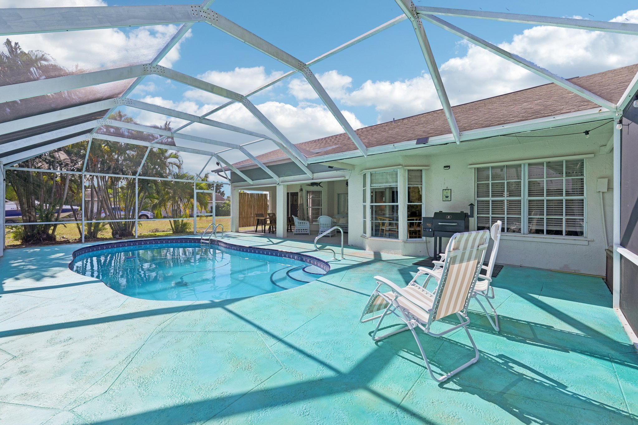 Listing photo of a screened pool and lanai